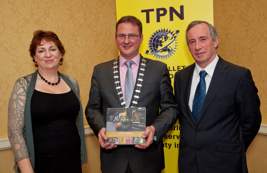 Owen Cooke from D102 - Independent Express being presented with the TPN book by Eoin Gavin IRHA