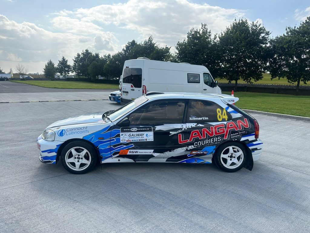 Jason Gorham and John Kilmartin's Honda Civic in Langan Couriers & The Pallet Network livery at the Galway Summer Stages Rally 2024.